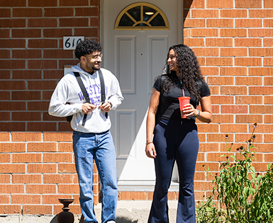 Two tenants out front of a townhouse