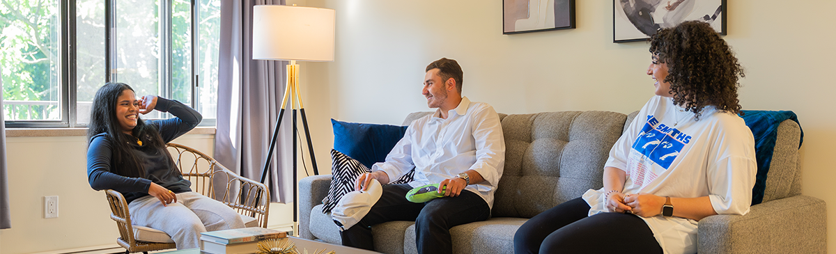 Three tenants talking in their living room